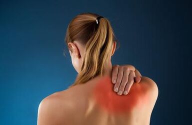 Back pain in the shoulder blades in a woman